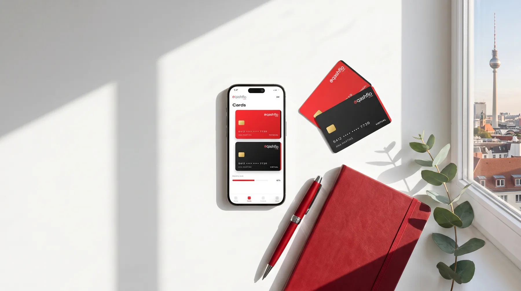 Qashflo phone and cards with a Berlin backdrop
